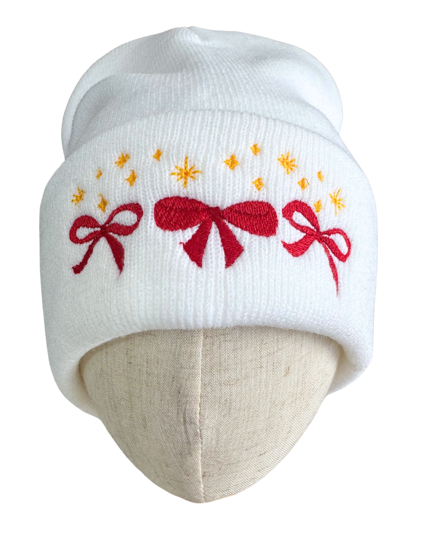 White beanie with red bows and golden star embroidery in Kansas City Chiefs colors.

