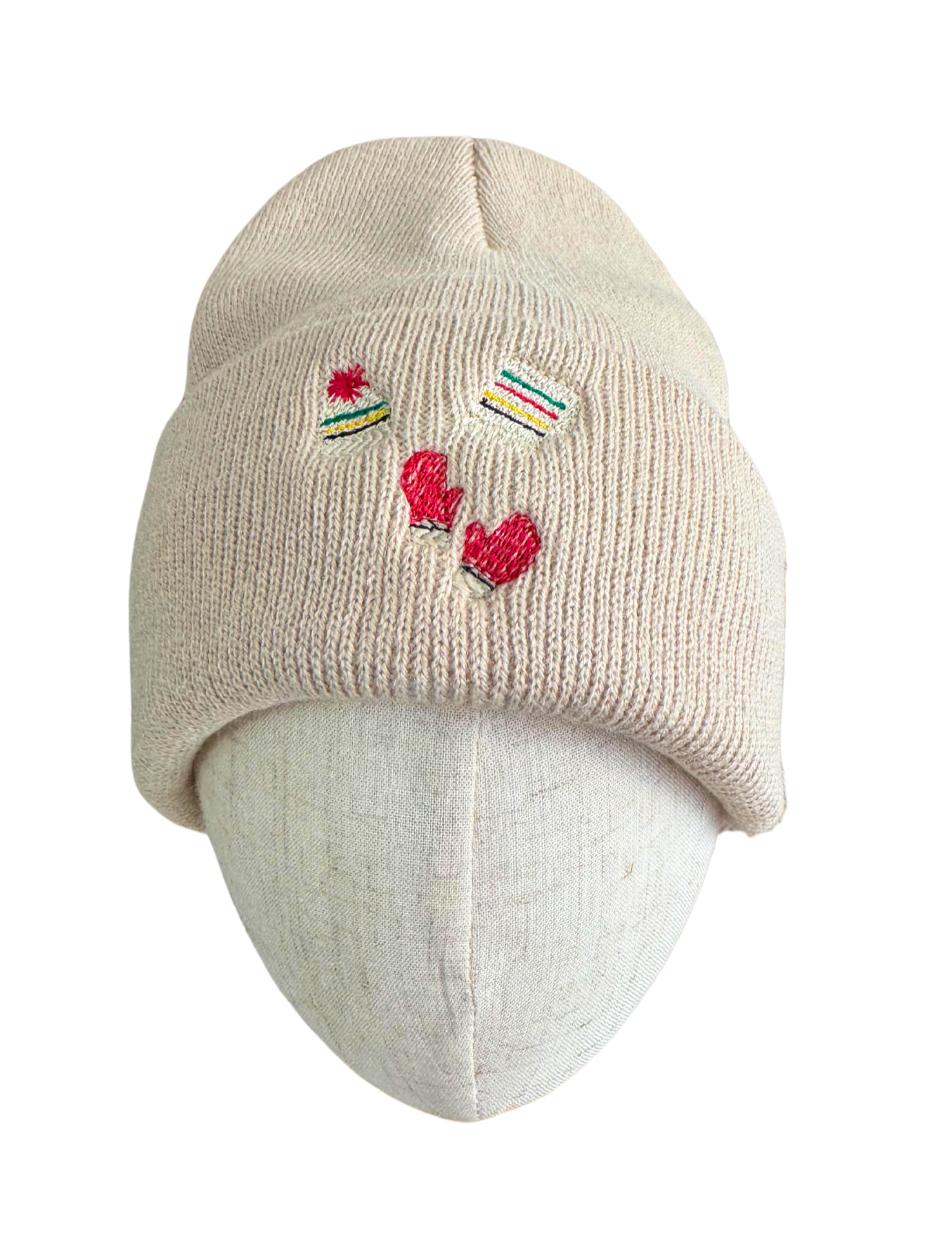 Beige winter beanie with embroidered Pendleton Glacier-inspired designs, including striped hats and red mittens.

