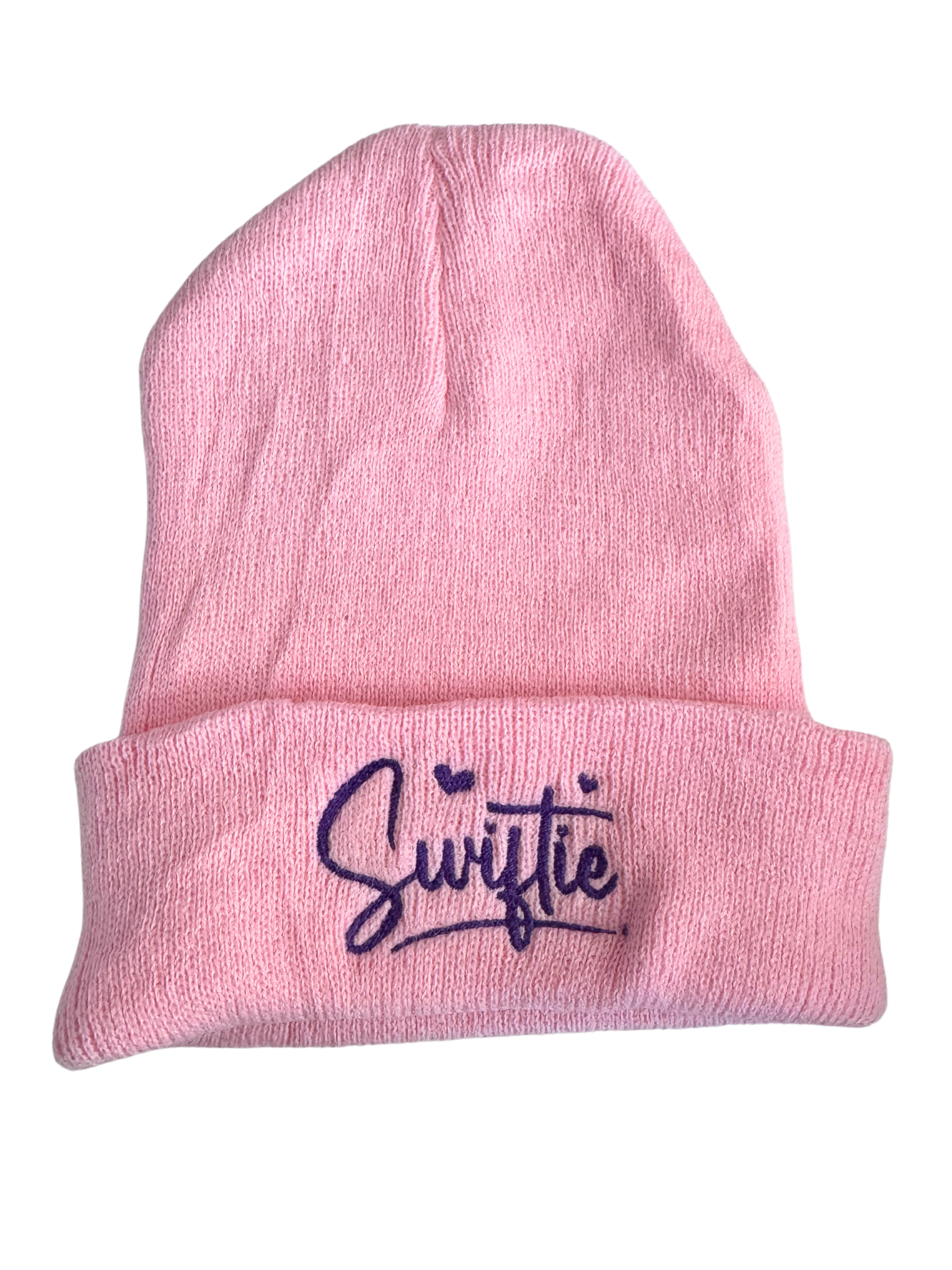 Pink beanie with "Swiftie" embroidered in purple lettering and hearts design.

