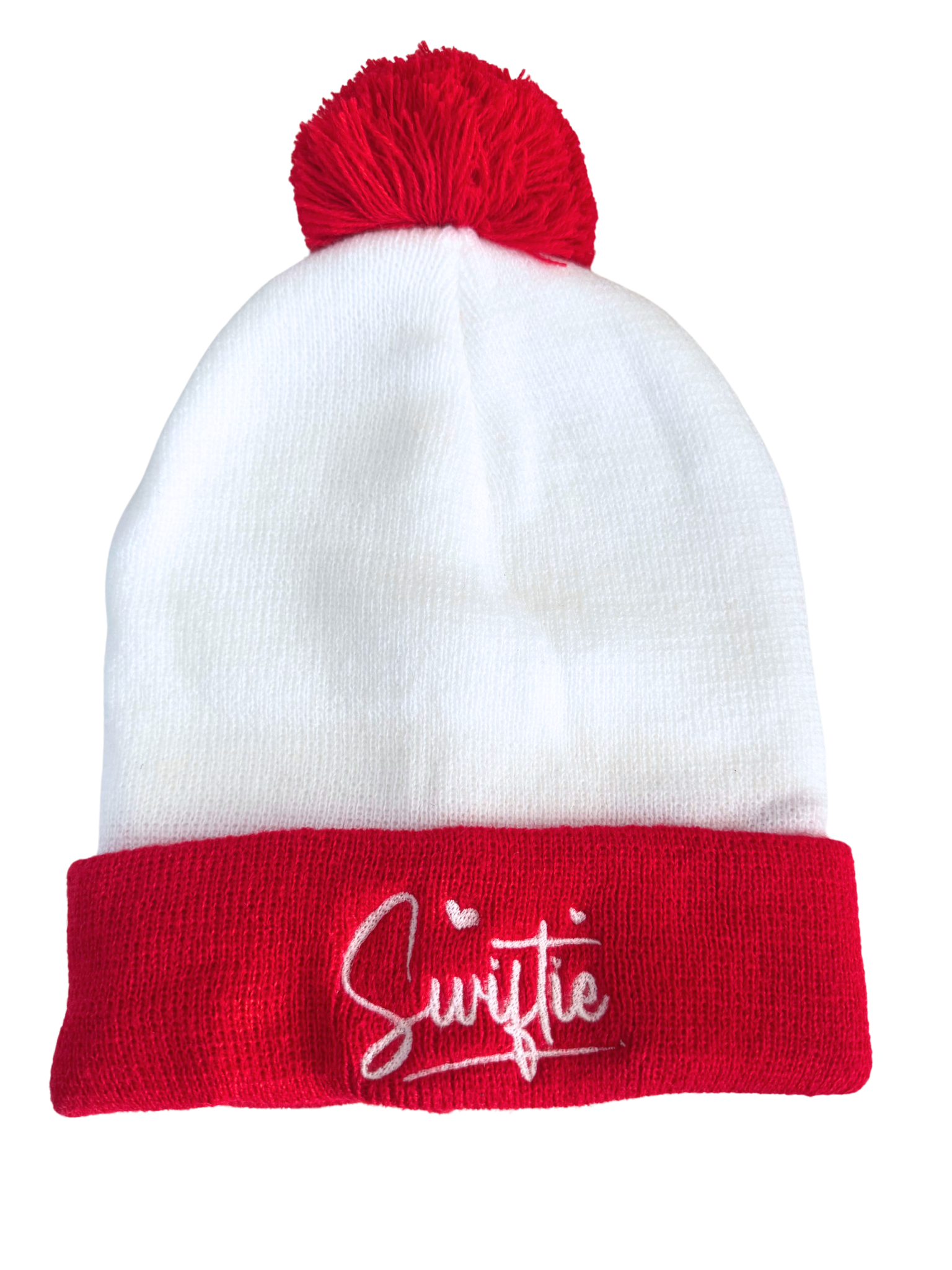 Red and white beanie with a red pom, featuring "Swiftie" embroidered in white.

