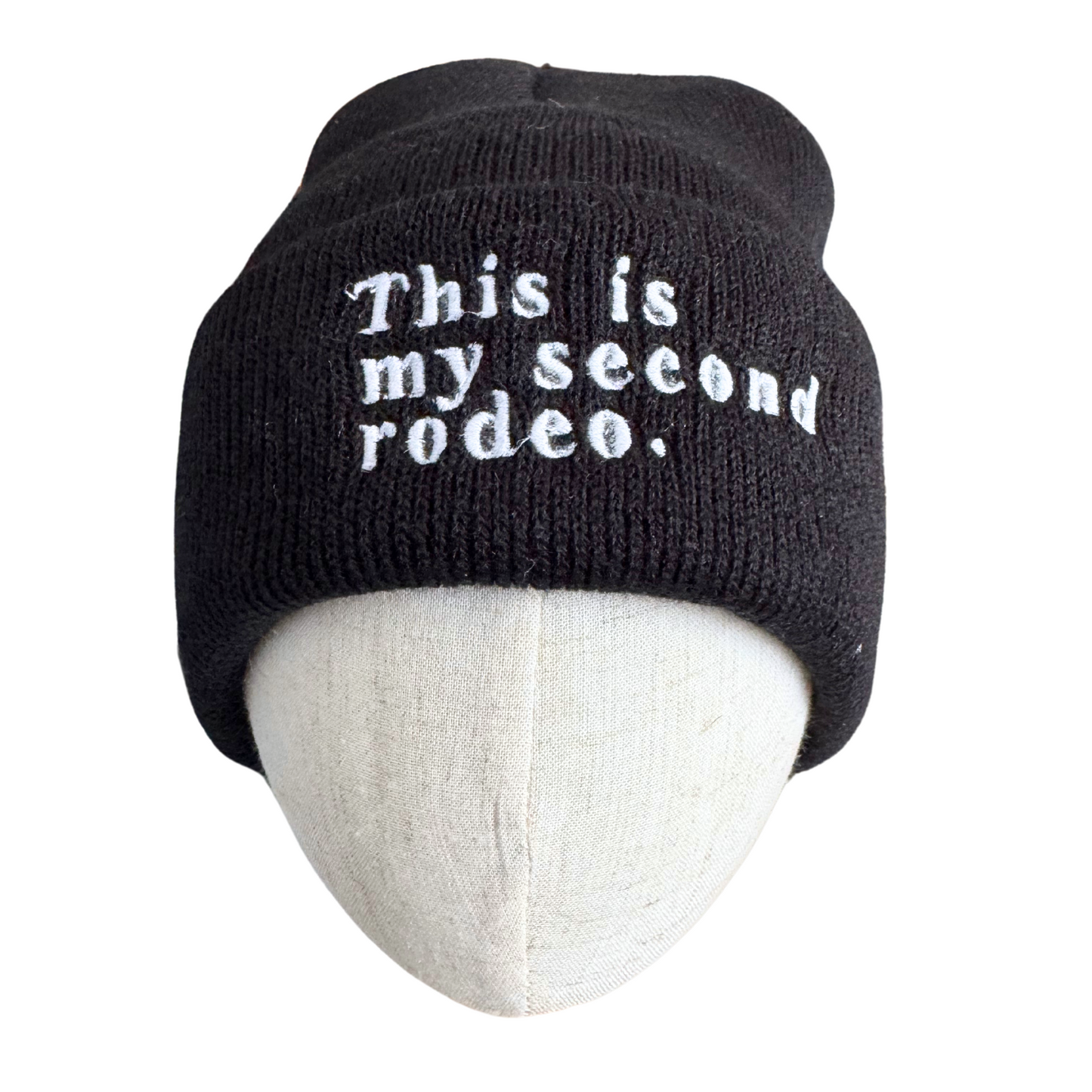 Embroidered black beanie with "This is my second rodeo" text.