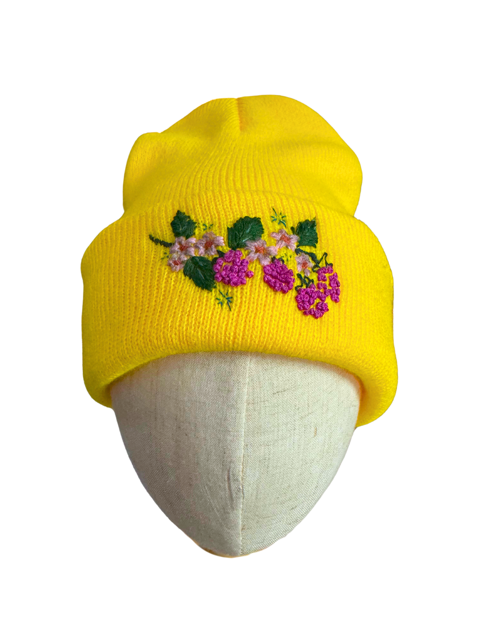 Bright yellow hand embroidered beanie with vibrant berry floral design.