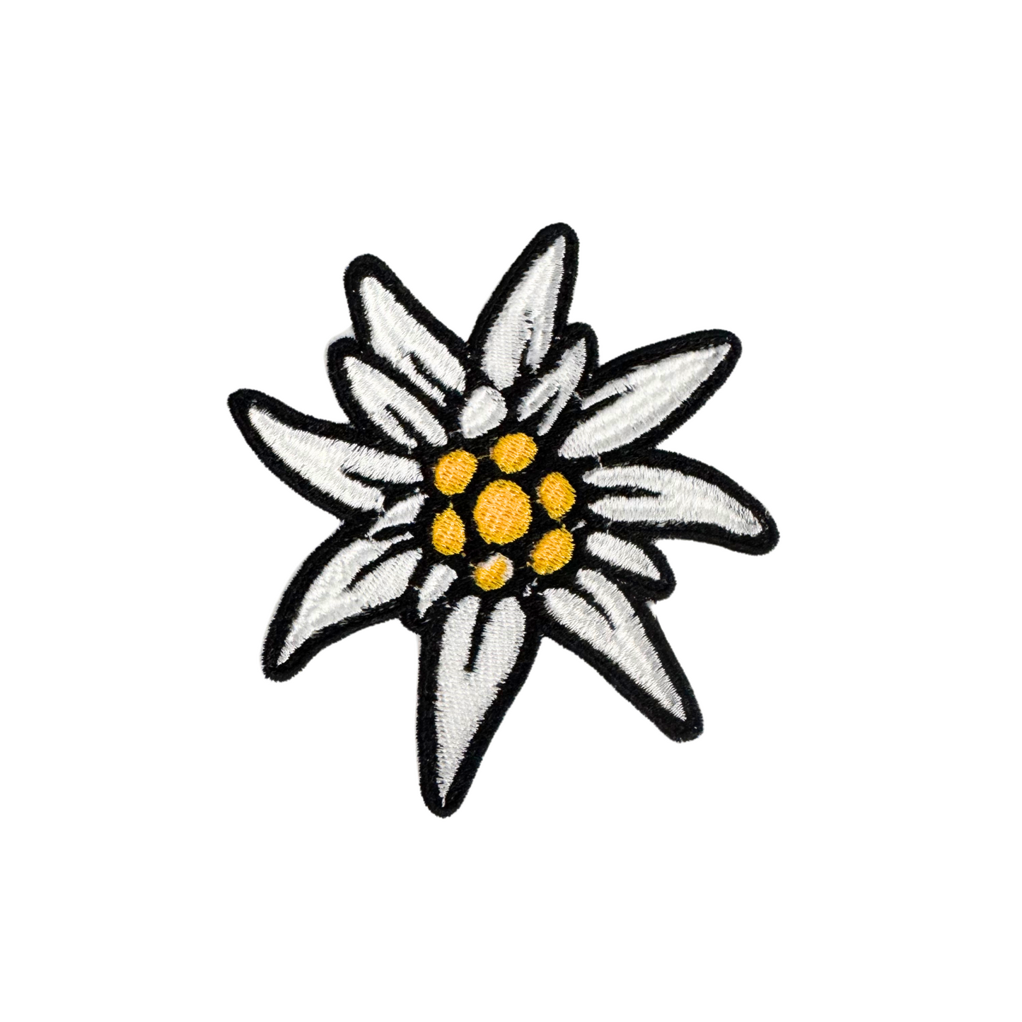 Handmade Edelweiss flower iron-on patch with white petals and golden center embroidery.