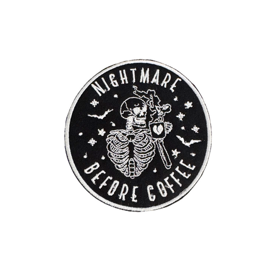 Handmade "Nightmare Before Coffee" iron-on patch featuring a skeleton design with bats and stars, ready to ship.

