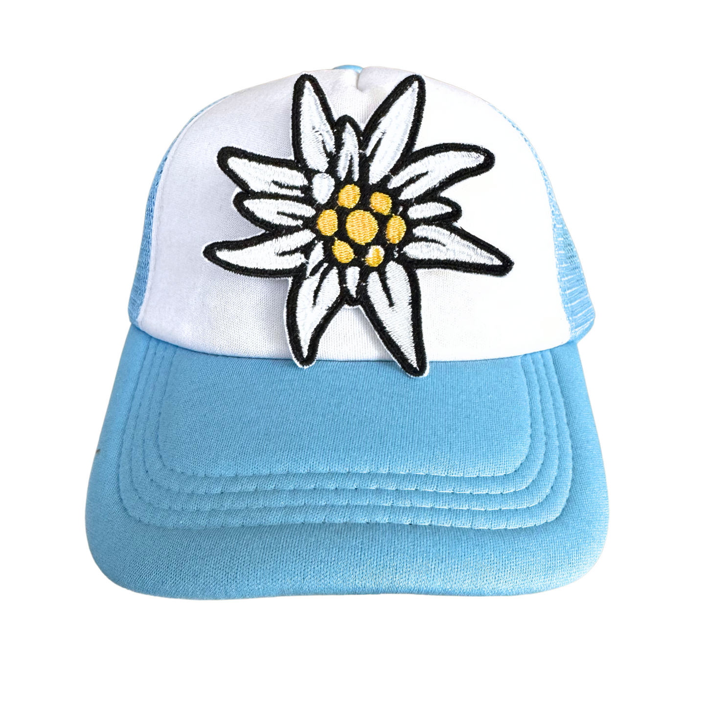 Handmade Edelweiss flower iron-on patch with white petals, golden centers, and black embroidery, ready to ship.

