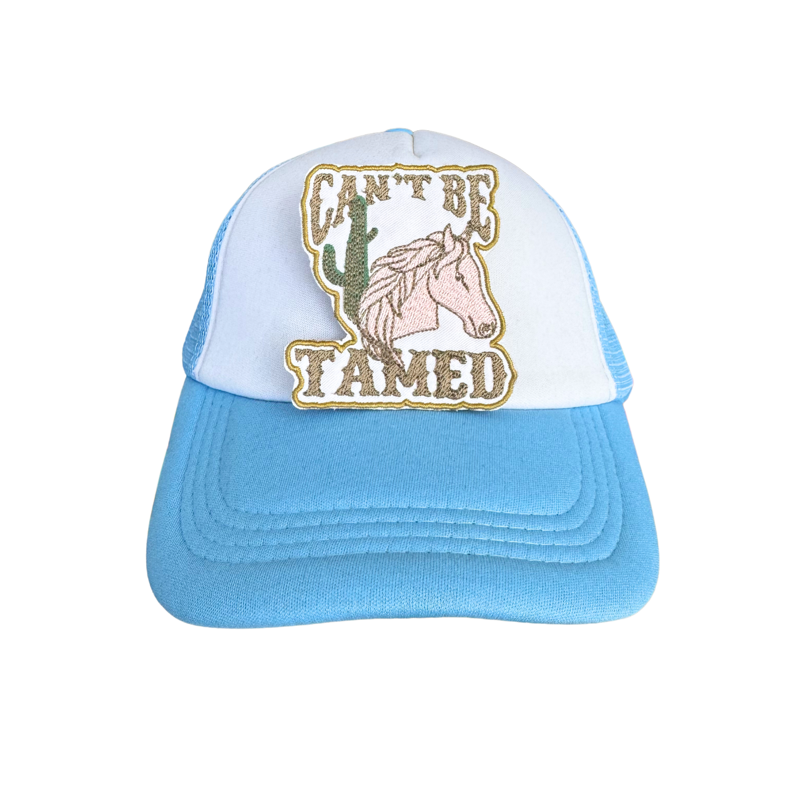 Trucker hat with "Can't Be Tamed" embroidered patch, perfect for cowgirl fashion lovers.

