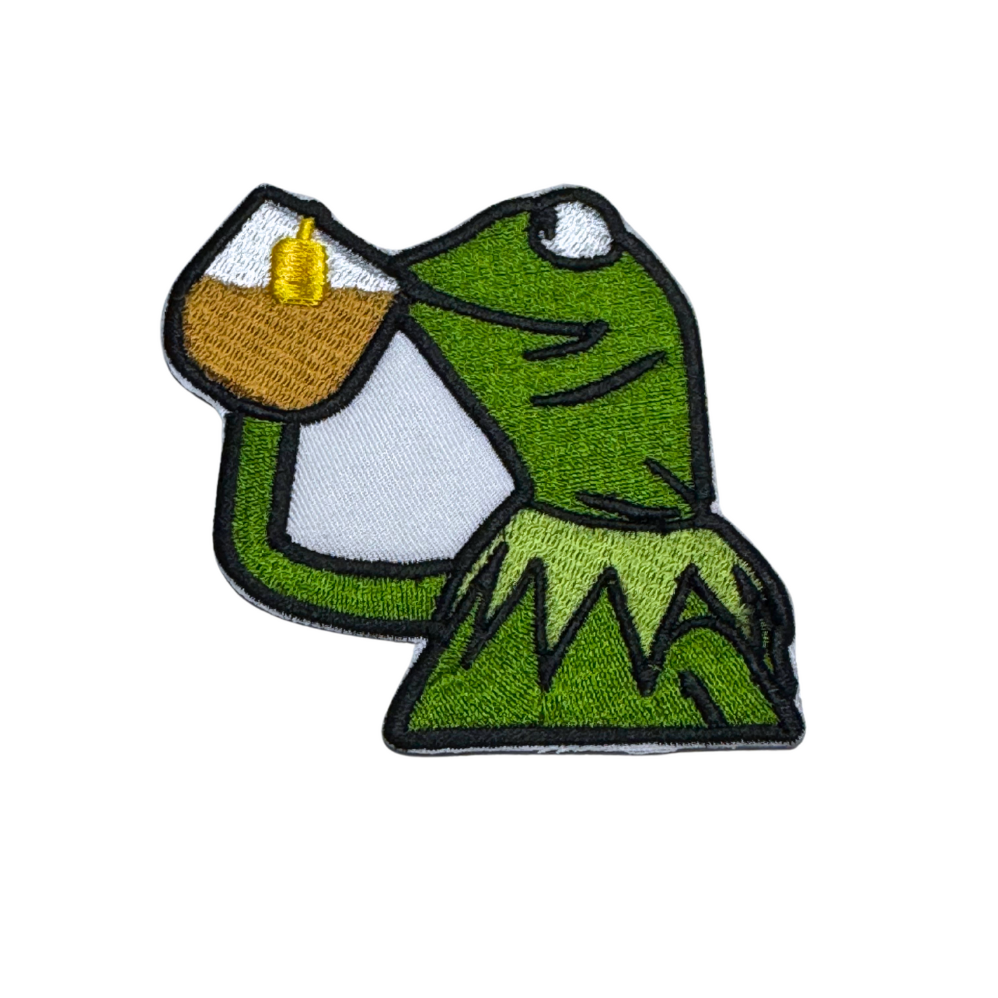 Embroidered patch featuring a green frog sipping from a glass, inspired by popular meme culture.
