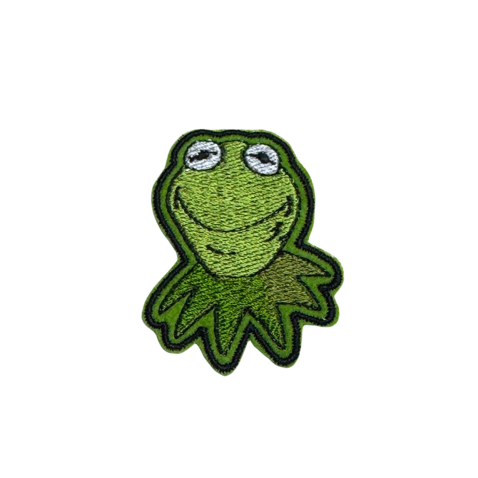 Embroidered patch featuring a cheerful green frog with a spiky collar and a big smile.
