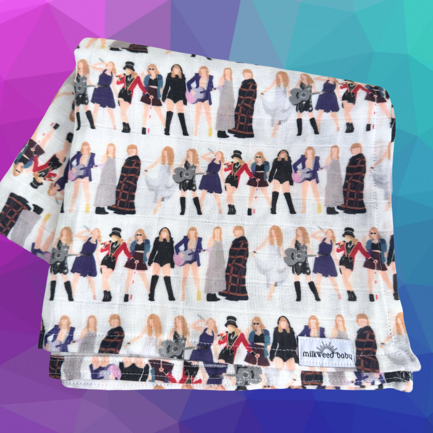 Taylor Swift-inspired baby swaddle blanket folded and placed against a geometric purple and blue background, showcasing the intricate details of the Eras Tour outfit designs.

