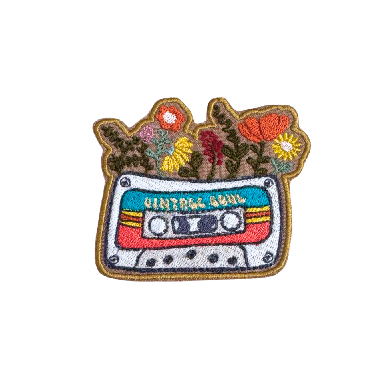 Embroidered patch featuring a colorful retro cassette tape with wildflowers and the words "Vintage Soul."
