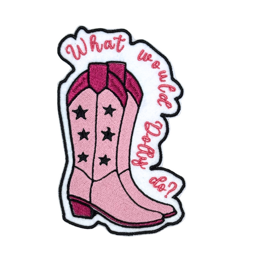 Close-up of an embroidered "What Would Dolly Do?" patch featuring pink cowboy boots.
