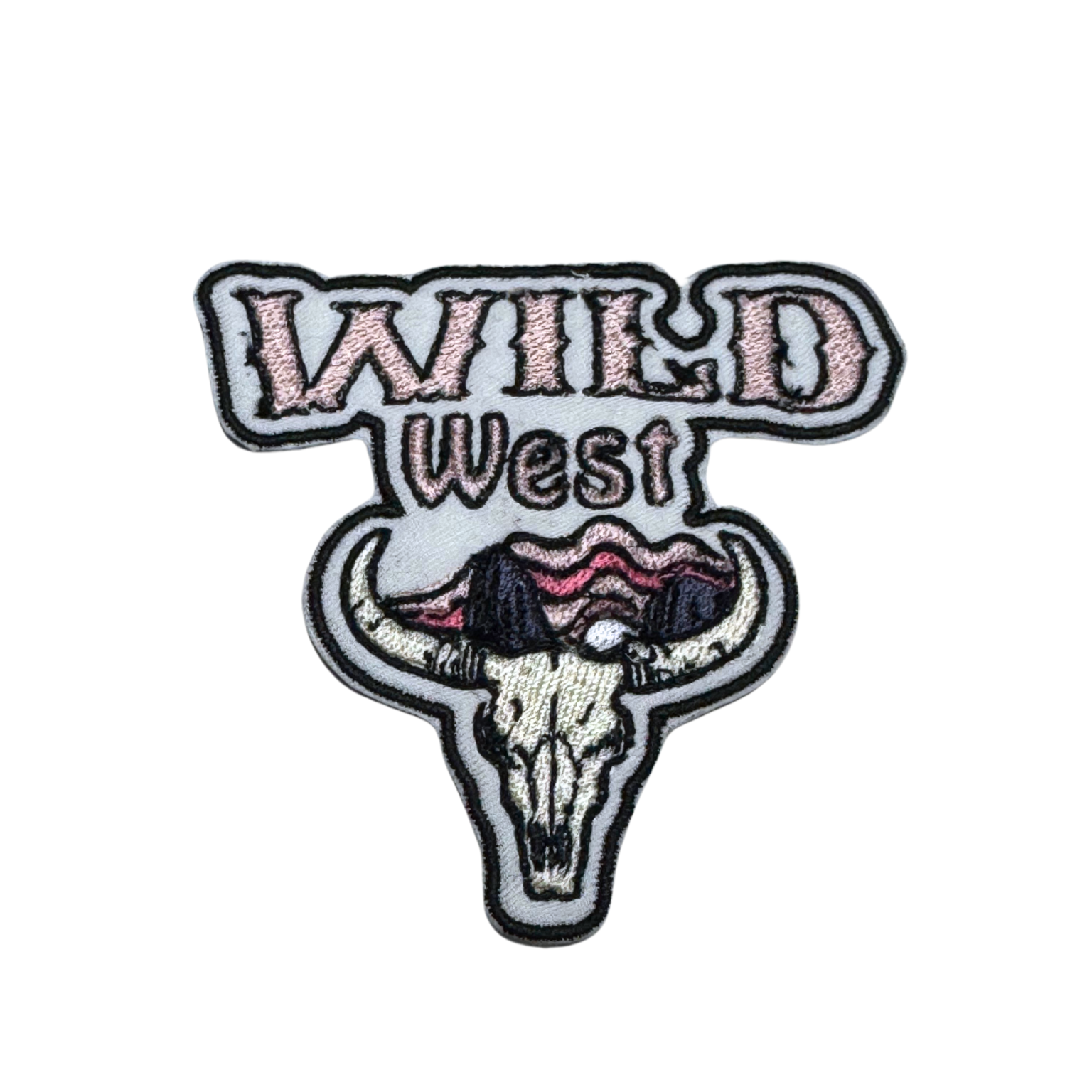 Embroidered patch featuring a Western-style "Wild West" text with a detailed cow skull and a desert landscape in warm tones.
