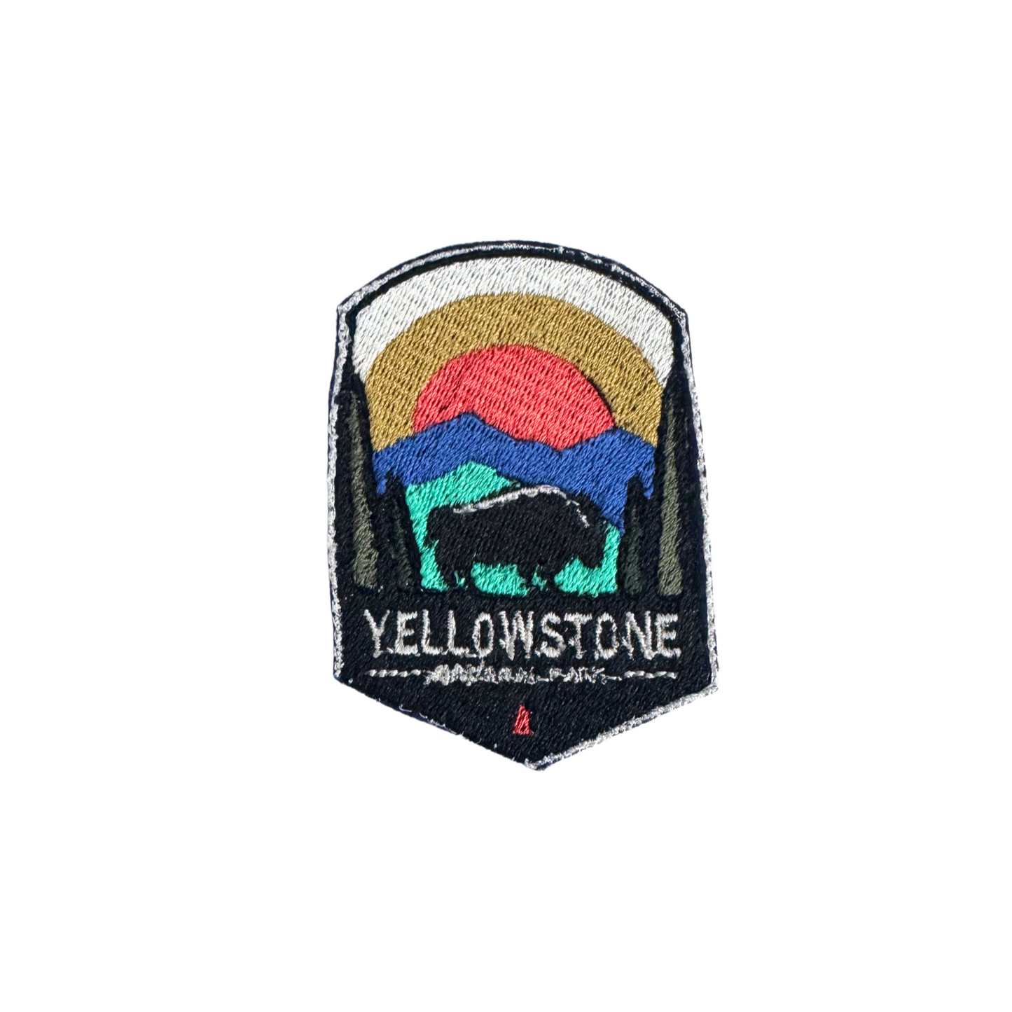 Handmade Yellowstone National Park embroidered patch with a bison silhouette, vibrant sunset, and mountain scene.
