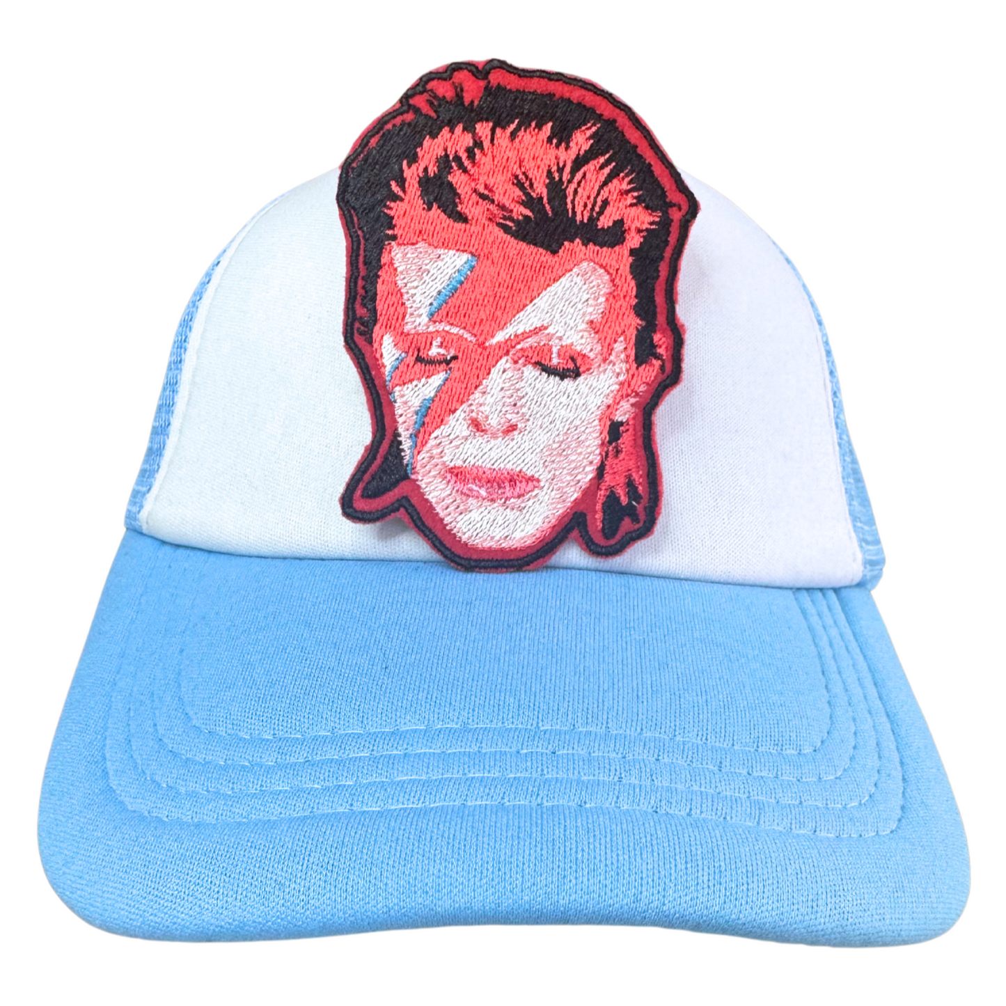 Ziggy Stardust embroidered patch applied to a light blue trucker hat.
